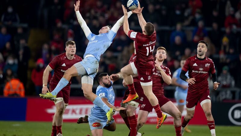 Andrew Conway and Bastien Guillemin compete in the air. Photo: Morgan Treacy/Inpho
