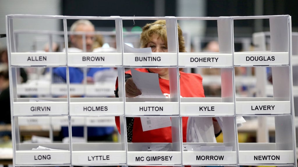 A count supervisor sorts voting papers at the Titanic Exhibition Centre, Belfast, after elections to decide the make-up of the next Stormont Assembly. Photograph: Liam McBurney/PA Wire