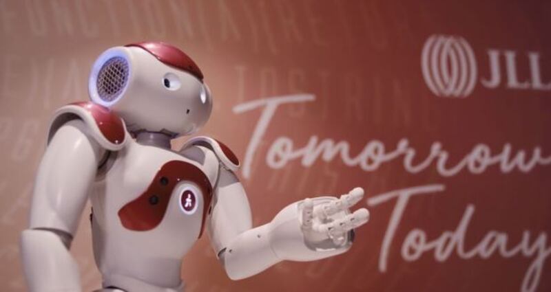 Pictured is JiLL, a robot with inbuilt facial recognition software, who greets visitors at real estate firm JLL’s Sydney office.