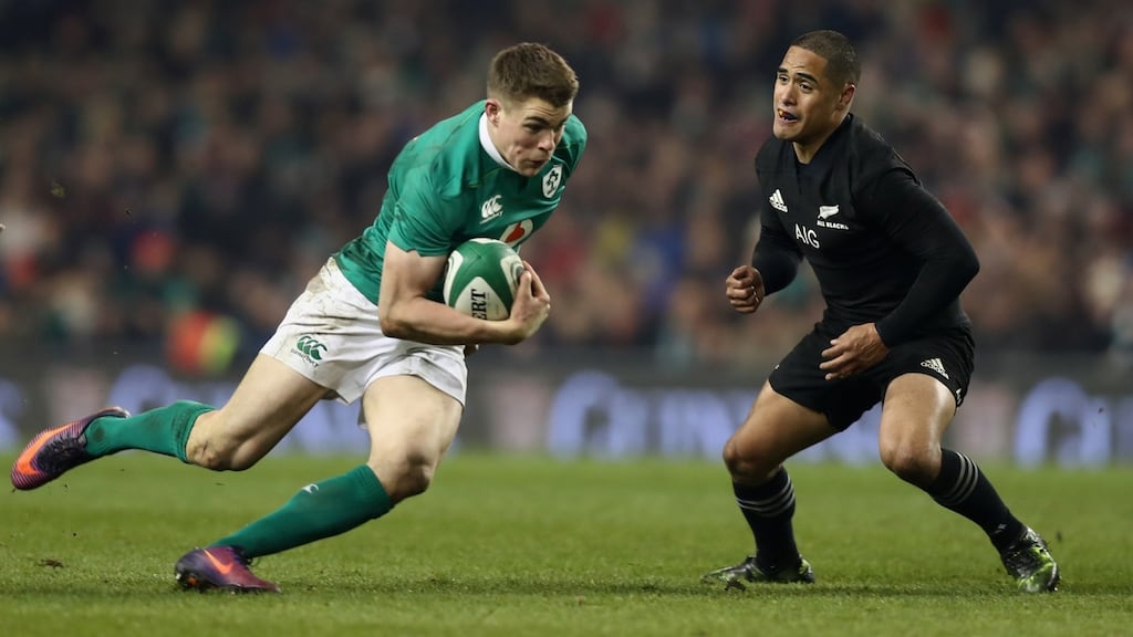 Ireland’s Garry Ringrose runs past Aaron Smith of New Zealand at the Aviva Stadium where Ireland were defeated 9-21. Photograph: Phil Walter/Getty Images