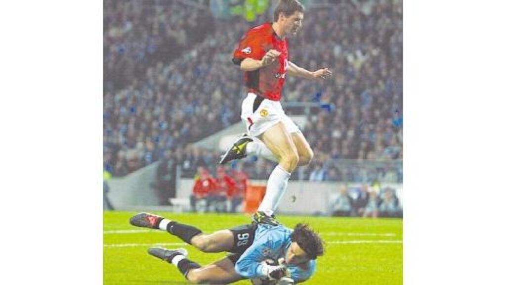 Manchester United captain Roy Keane steps on FC Porto goalkeeper Vitor Baia.