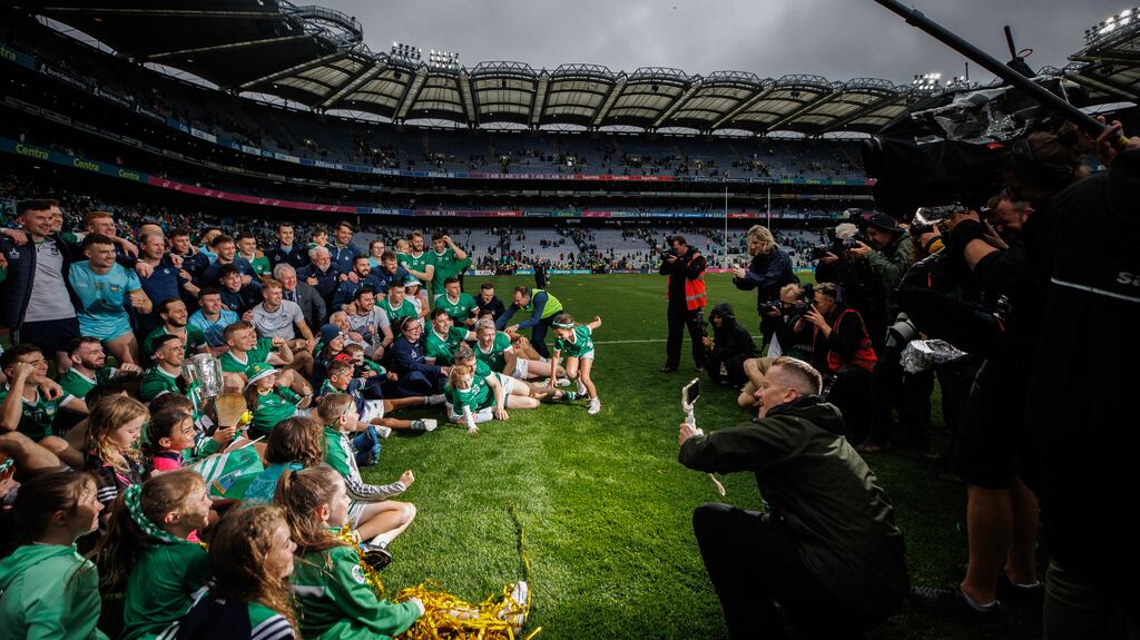 The Limerick squad celebrate together with their families after their All-Ireland final win over Kilkenny. Photograph: James Crombie/Inpho