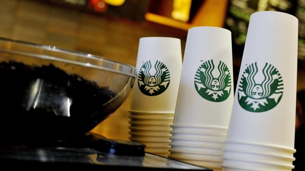 Starbucks takeaway cups at a Starbucks in central London, as the coffee shop chain announced it is moving its European headquarters from the Netherlands to the UK following a row over tax avoidance. Photograph: Nick Ansell/PA Wire