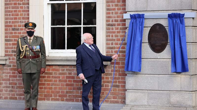 President Michael D Higgins unveils a plaque at the State commemoration to mark the centenary of the handover of Dublin Castle. Photograph: Dara Mac Dónaill