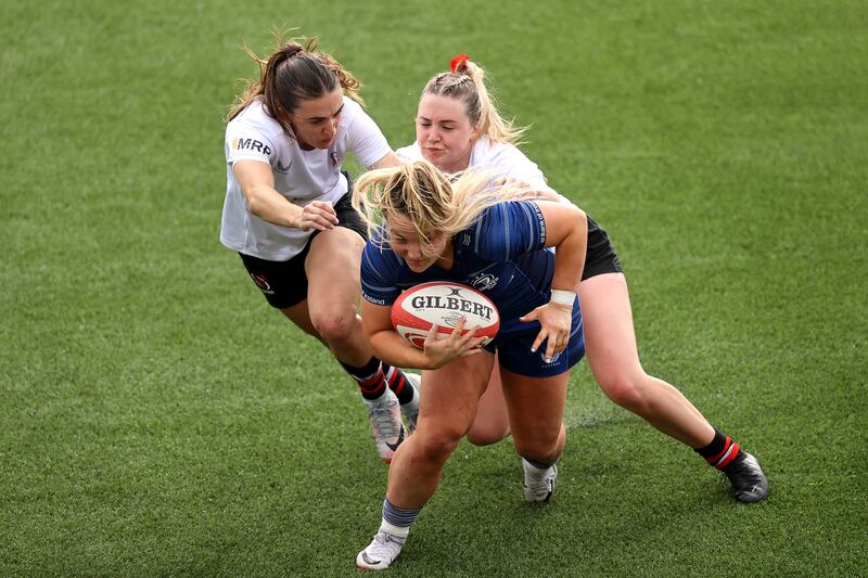 Ulster's Lauren Farrell McCabe and Lauren Patterson tackle Aoife Dalton of Leinster during the Vodafone Women's Interprovincial Championship match at Kingspan Stadium in Belfast. Photograph: Bryan Keane/Inpho