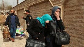 Iraqi forces seize Mosul bridge as thousands of civilians flee