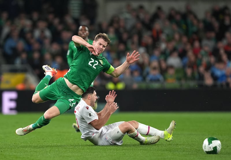 Nathan Collins and Styopa Mkrtchyan collide during the game at the Aviva Stadium. Photograph: Niall Carson/PA Wire