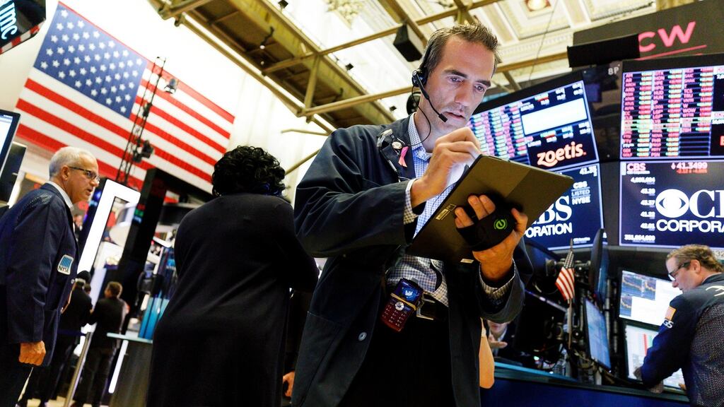 Traders work on the floor of the New York Stock Exchange in New York. Photograph: Justin Lane/ EPA