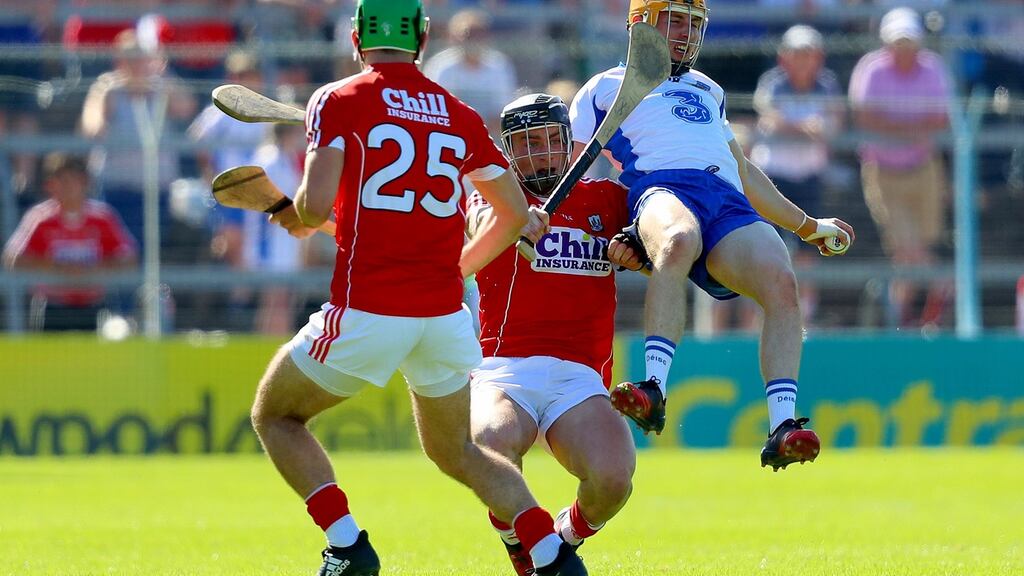 Cork’s Michael Cahalane and Colm Spillane with Waterford’s Tommy Ryan during the Munster senior hurling semi-final at Semple Stadium. Photograph: INPHO/Oisin Keniry