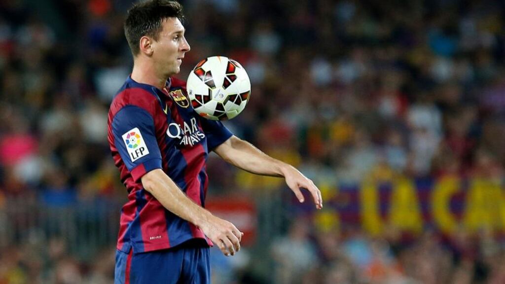 Barcelona’s Lionel Messi controls the ball during the Spanish first division soccer match against Elche at Nou Camp stadium. Photograph: Gustau Nacarino/Reuters