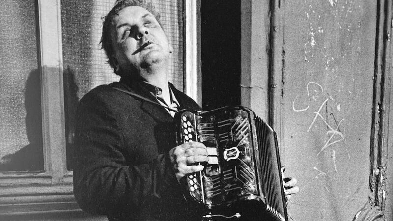 Bob, a blind Irish accordion player, Portobello Road 1975. Photograph: Markéta LuskaÄ?ová