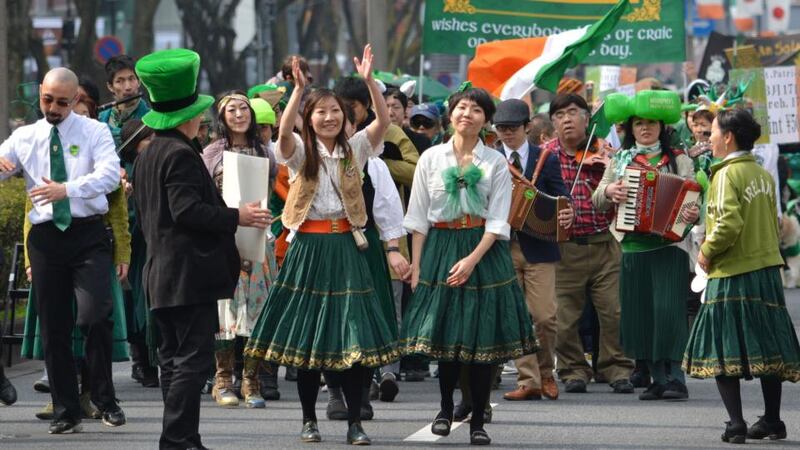 People march during a St Patrick’s Day parade in Tokyo. More than 1,000 took part in the event. Photograph: Kazuhiro Nogi/AFP/Getty Images.
