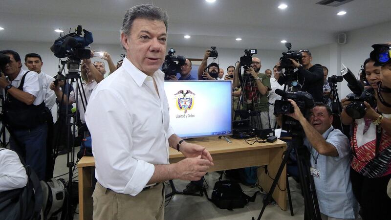 Colombian President Juan Manuel Santos (C) attends a press conference to announce the finding of the 18th-century Spanish galleon San José in the Colombian Caribbean, in Cartagena, Colombia. Photograph: Maldonado Rozo/EPA.
