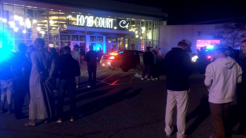 This image from video provided by KSTP 5 television shows people standing outside the scene of a stabbing at the Crossroads Centre mall in St Cloud, Minnesota. Photograph: KSTP TV/HO/AFP/Getty Images