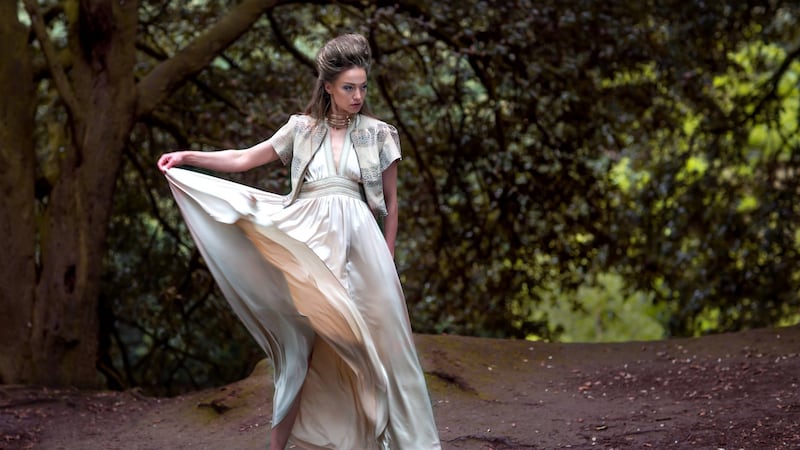 Gold embossed leather cropped zip jacket €795, silk halter dress with gold braided trim €995. Photograph: Una Williams