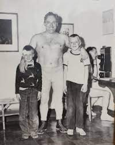 Dr. John "Dropkick" Murphy with two of his sons, David (left) and Richard (right) at Bellows Farm in Acton