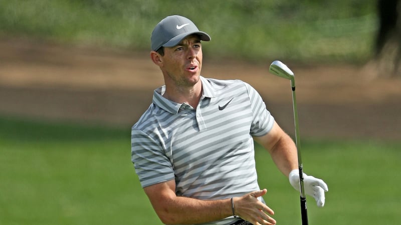 McIlroy reacts to his second shot on the par four, ninth hole. Photo: David Cannon/Getty Images