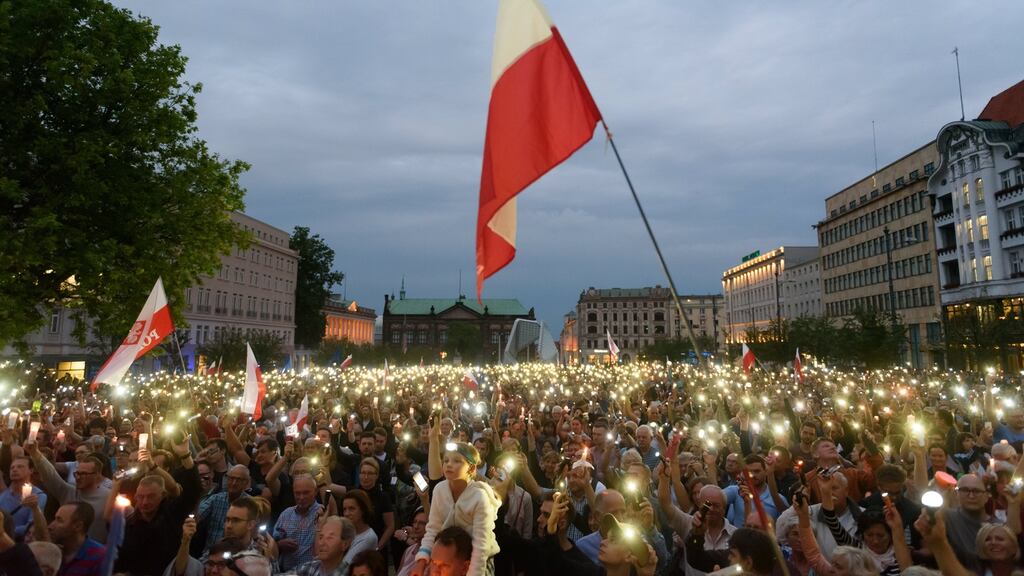 People participate in a protest at Freedom Square in Poznan, Poland on Sunday. Photograph: Jakub Kaczmarczyk/EPA