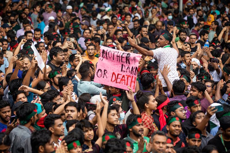 People participate in a protest march against prime minister Sheikh Hasina and her government. Photograph: Rajib Dhar/AP