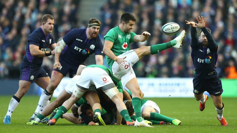 Conor Murray is blocked by Greig Laidlaw of Scotland as he attempts a kick. Photo: James Crombie/Inpho