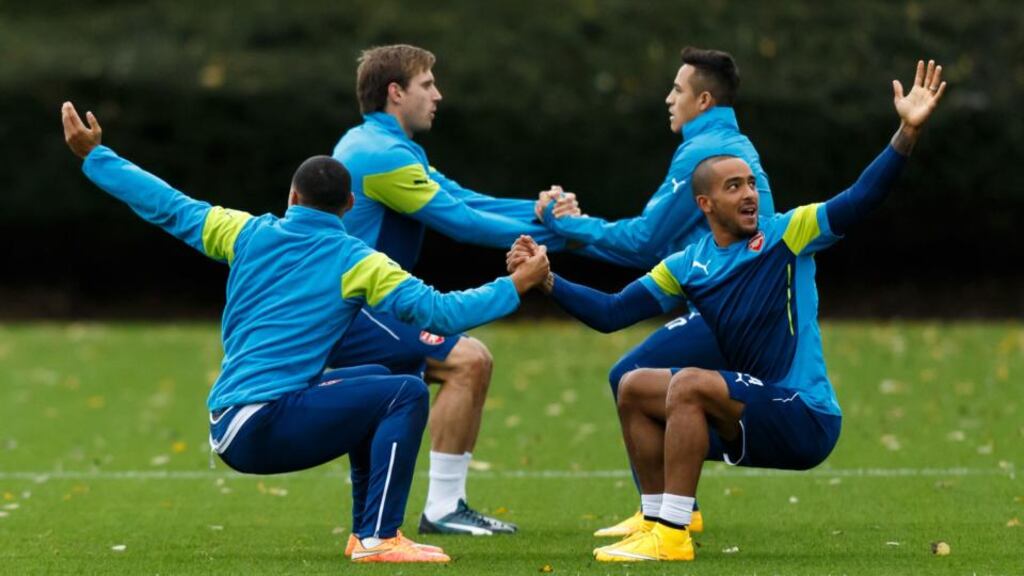 Arsenal’s Theo Walcott (right) in training yesterday with teammate Alex Oxlade-Chamberlain
(left) during a training session at London Colney. PRESS ASSOCIATION Photo. Picture date: Monday November 3rd, 2014. See PA story SOCCER Arsenal. Photo credit should read
. Walcott’s current contract is due to expire in the summer of 2016. Photograph: John Walton/PA Wire