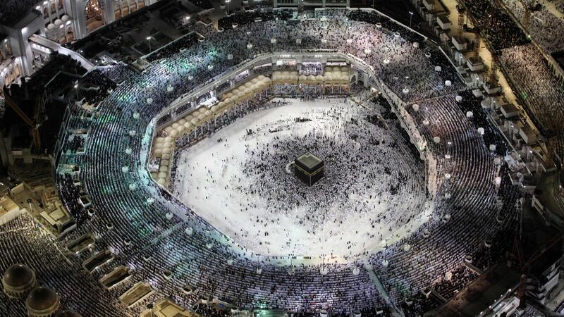 Mecca attack: worshippers pray at the Kaaba, at the Grand Mosque. Photograph: Bandar Aldandani/AFP/Getty