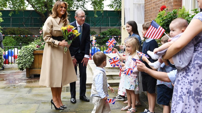 First lady fashion: Melania Trump’s trench coat suited the wet weather at a Downing Street garden party. Photograph: Facundo Arrizabalaga EPA/Pool/Getty
