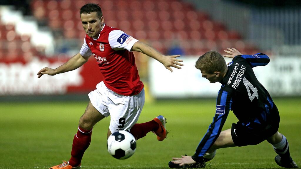 Christy Fagan of St Patrick’s Athletic’s and Athlone Town’s Derek Prendergast during a League of Ireland match in 2014. Photograph: Ryan Byrne/Inpho