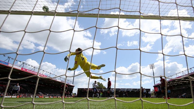 Mark Travers of AFC Bournemouth makes a save during his debut against Tottenham last May. Photo: Warren Little/Getty Images