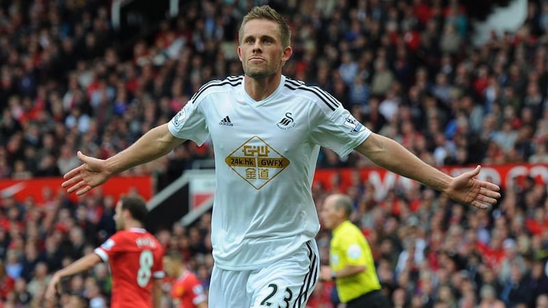 Swansea City’s Gylfi Sigurdsson cerebrates scoring the winner against Manchester United. Photograph: Peter Powell / EPA
