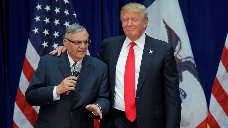 Donald Trump is joined onstage by former Maricopa county sheriff Joe Arpaio (Left) at a campaign rally in Marshalltown, Iowa in 2016, after Arpaio endorsed Mr Trump’s candidacy.