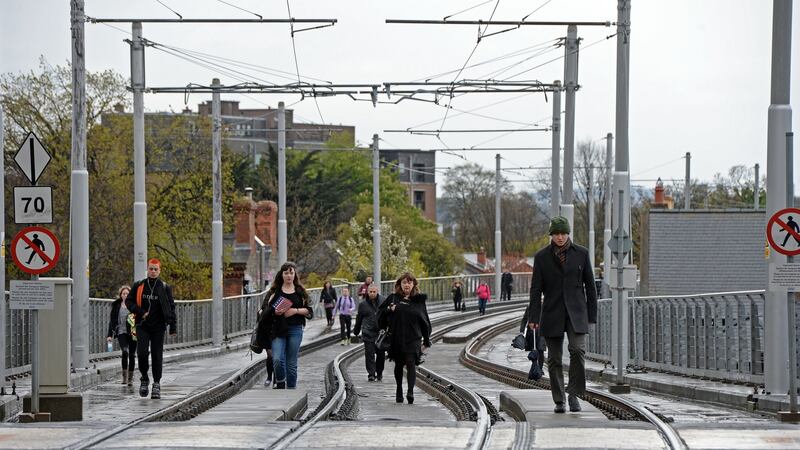 With Luas workers on strike, commuters make their way into the city centre, along the Luas lines near Harcourt street, Dublin. Photograph: Eric Luke / The Irish Times