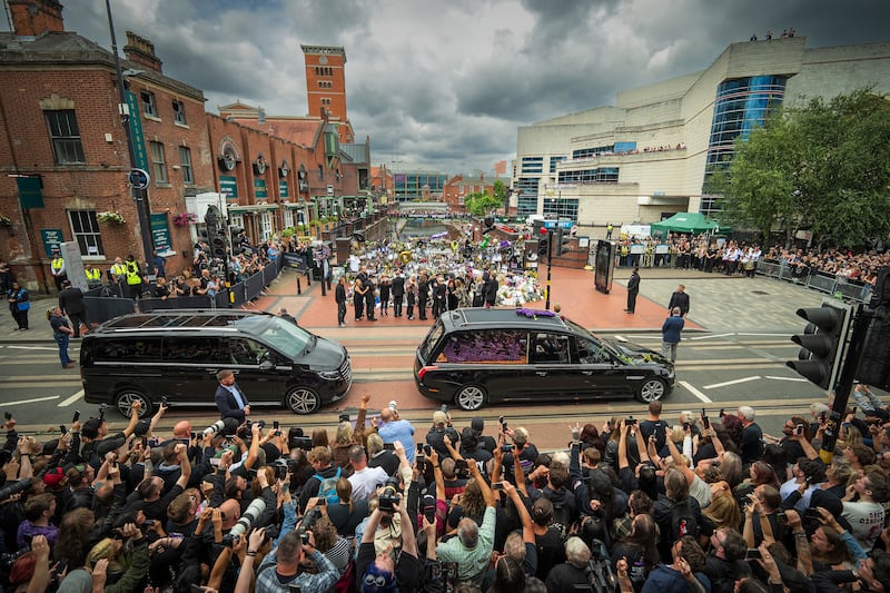 Sharon Osbourne, Jack Osbourne, Kelly Osbourne and Aimee Osbourne view tributes to the late Ozzy Osbourne from fans at Black Sabbath Bench and Bridge. Photograph: Christopher Furlong/Getty Images
