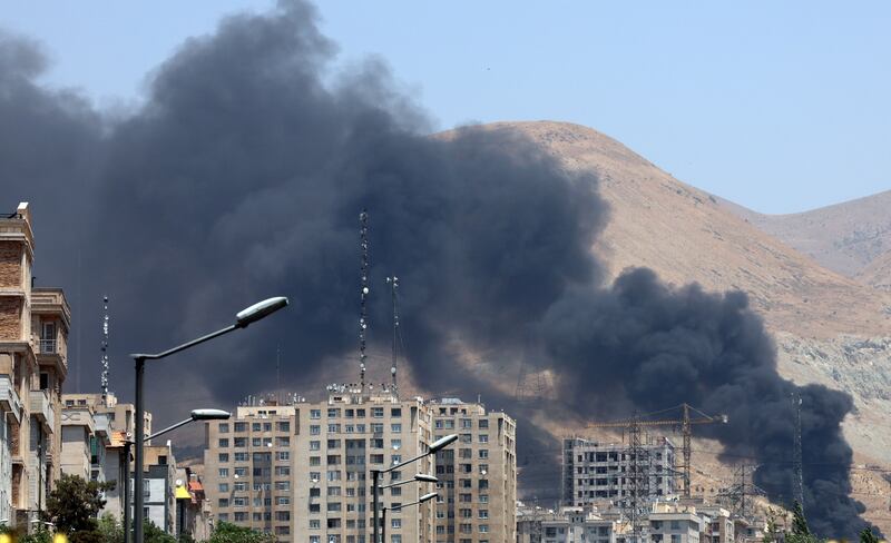 Smoke rises from an oil refinery northwest of Tehran. Photograph: Abedin Taherkenareh/EPA