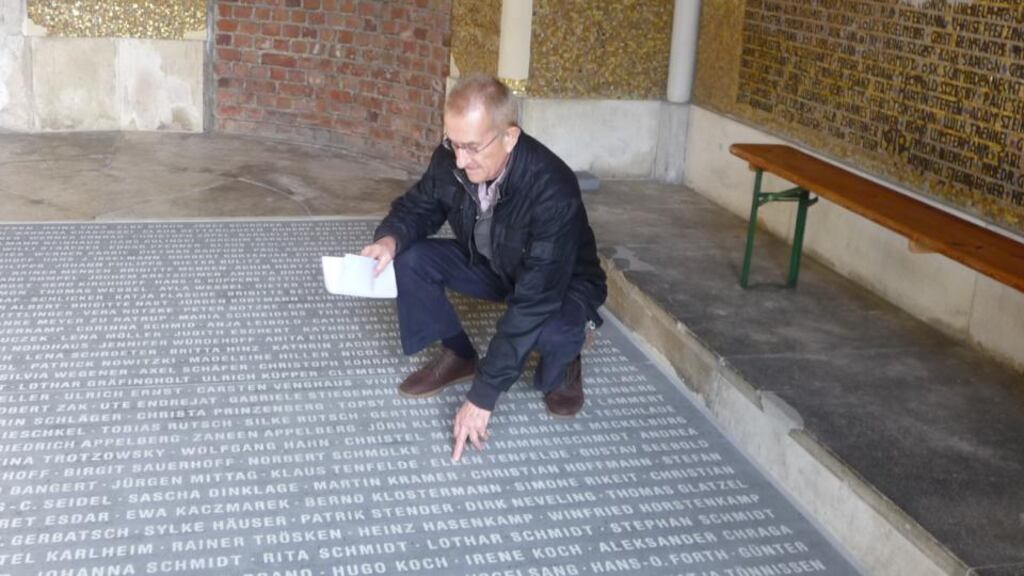 Naming names: Jochen Gerz with one of the slabs in the Bochum church vestibule