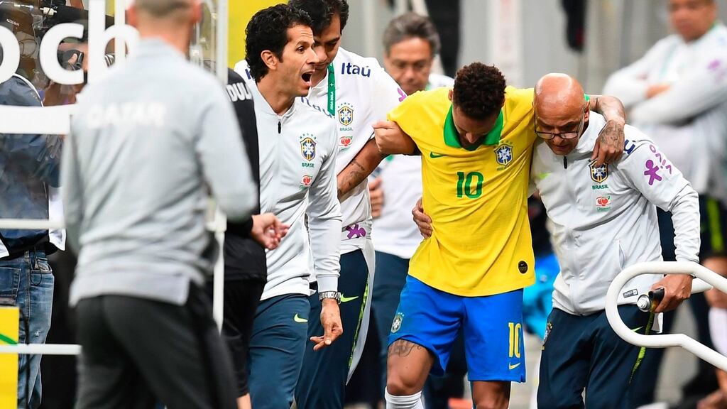 Brazil’s Neymar leaves the pitch injured during a friendly against Qatar. Photo: Evaristo Sa/Getty Images