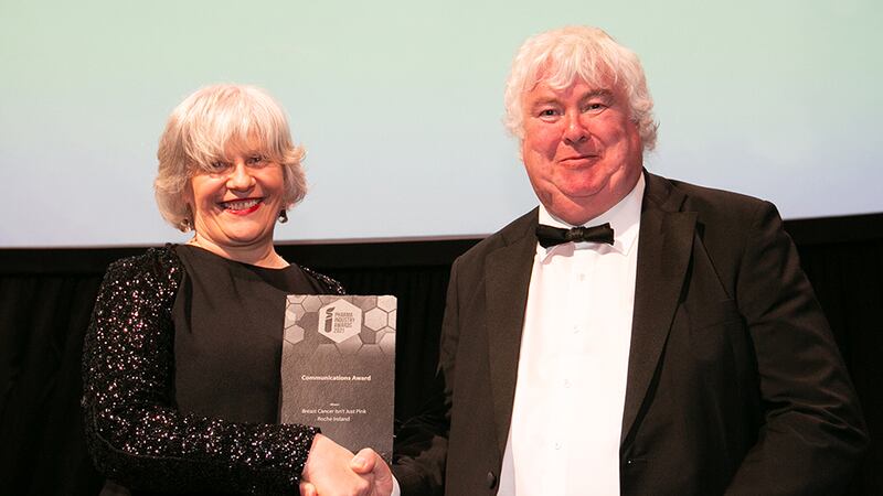 Carmel Fitzpatrick, Regional Director UK and Ireland, Eurofins Biopharmaceutical Product Testing, presents the Communications Award to Prof. Mike Lyons, Awards Judge, on behalf of Roche Ireland.