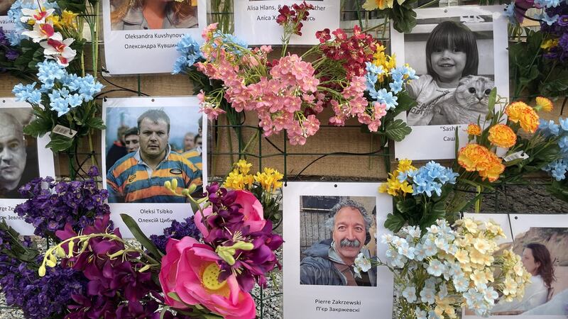 An Easter memorial in Lviv for civilians killed during Russia’s invasion, which includes photographs of Irish cameraman Pierre Zakrzewski and Ukrainian journalist Oleksandra Kuvshinova, who died in the same artillery attack in March. Photograph: Daniel McLaughlin