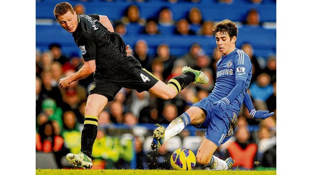 Wigan Athletic's James McCarthy (left) and Chelseas Emboaba Oscar in action at Stamford Bridge on Saturday.