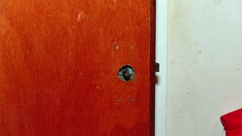 Undated handout photo issued by PSNI of a handle missing on a door in the home of Keith and Caroline Baker. Photograph: PA/PSNI