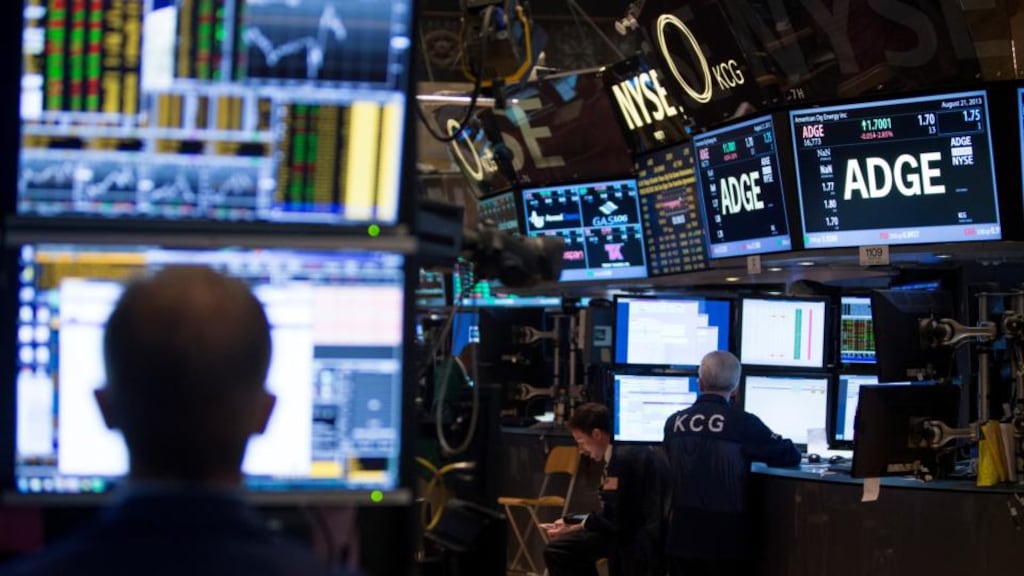 Traders work on the floor of the New York Stock Exchange. Photographer: Scott Eells/Bloomberg