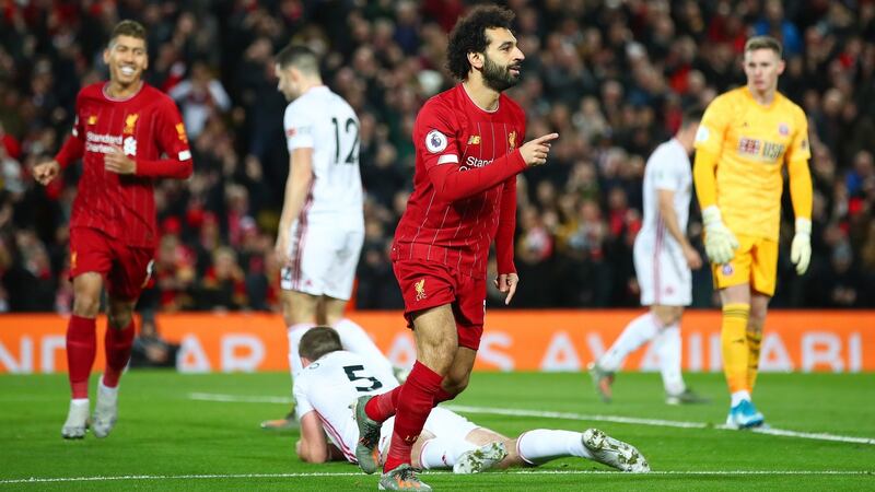 Mohamed Salah celebrates after scoring Liverpool’s first goal against Sheffield United at Anfield. Photograph: Clive Brunskill/Getty Images