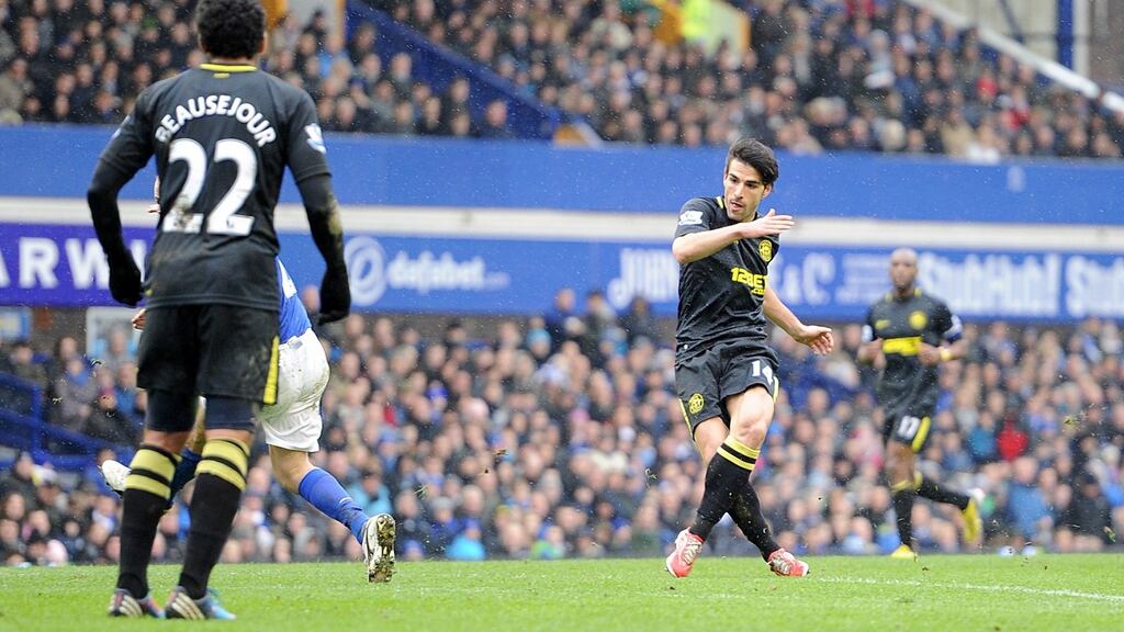 Jordi Gomez scores Wigan’s third goal against Everton.Photograph: Martin Rickett/PA Wire.