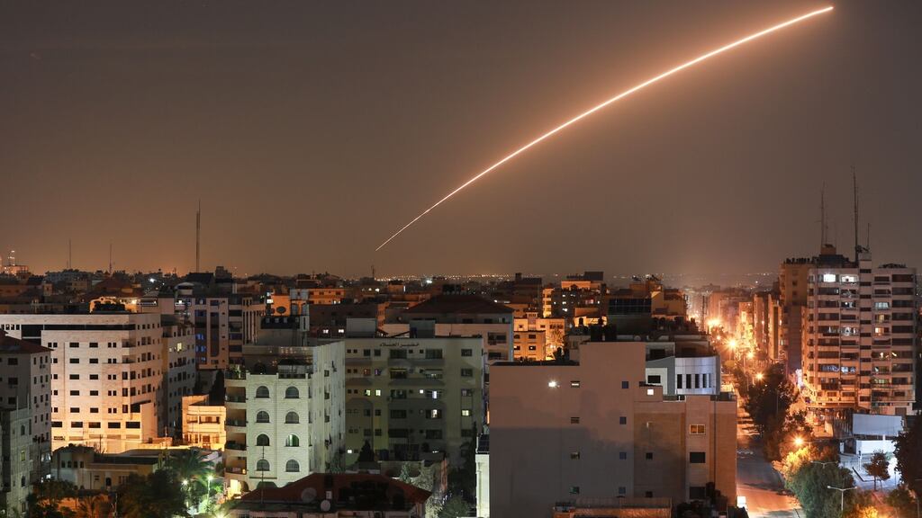 An Israeli missile launched from the Iron Dome defence missile system, designed to intercept and destroy incoming short-range rockets and artillery shells, is seen above Gaza city on Tuesday. Photograph: Bashar Taleb/AFP via Getty