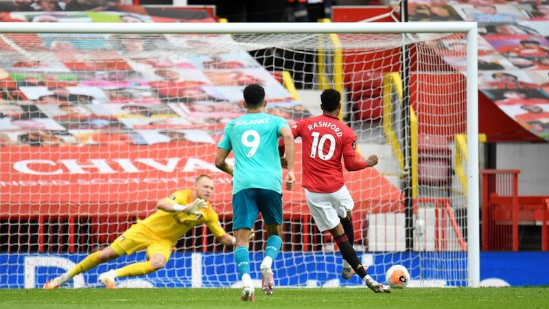 Marcus Rashford scores Manchester United’s second from the penalty spot. Photograph: Peter Powell/PA
