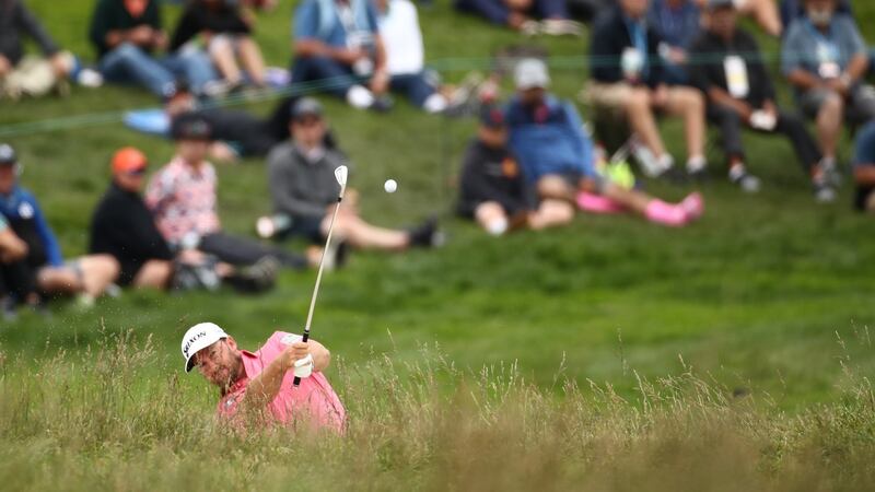 McDowell plays a shot on the third hole. Photo: Ezra Shaw/Getty Images