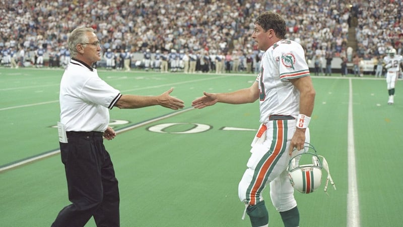 Miami Dolphins head coach Don Shula shakes hands with quarterback Dan Marino after a game against the Indianapolis Colts in 1995. Photograph: Jonathan Daniel/Allsport