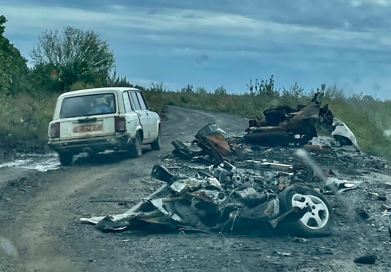 Destroyed cars on the road to Mospanove, northeastern Ukraine. The village was on the frontline of the Ukraine-Russia war until Kyiv's forces fully liberated the Kharkiv region this month. Photograph: Daniel McLaughlin