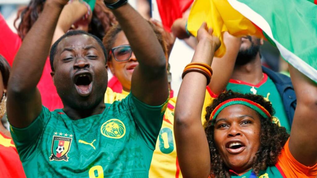 Cameroon supporters cher on their team ahead of their departure for the World Cup. Photograph: Ralph Orlowski / Reuters