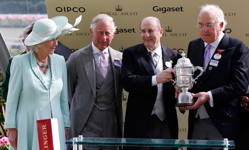 John Magnier (right) accepts a trophy at Royal Ascot 2015 from the then Duchess of Cornwall and Prince of Wales, along with fellow horse owner Michael Tabor. Photograph: Alan Crowhurst/Getty Images for Ascot Racecourse